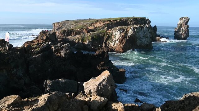 Rugged Papoa cliffs with atlantic waves below