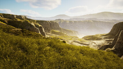 Obraz premium Expansive hills stretch across the horizon, bathed in soft sunlight. Lush greenery covers the ground, creating a serene atmosphere. The landscape invites exploration and adventure.