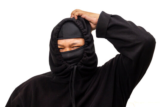 Confused hooded man scratching his head, eye partially hidden in a balaclava