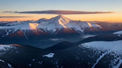 Majestic Mountain Peak Bathed in Golden Light at Sunrise.