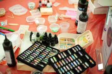 A set of sequins for making key chains from epoxy.