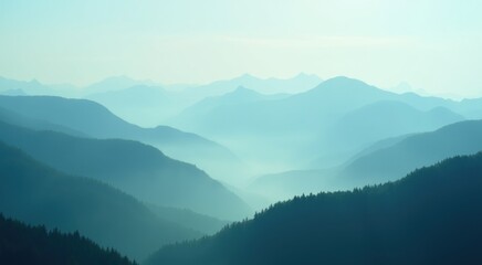 Obraz premium Mountains are covered in mist and fog as the sun rises
