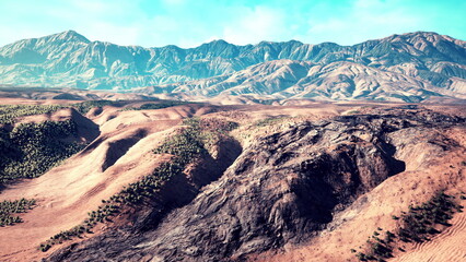 Rolling sand dunes stretch across the arid terrain, while towering mountains rise in the distance under a beautiful blue sky, showcasing natures power and serenity in this remote location.