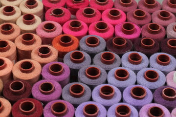 Close up, multi colored sewing threads and needlework. flat lay or top view.