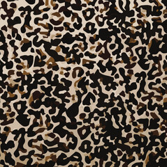 Leopard print. Vector seamless pattern. Animal skin background with black and brown spots on beige backdrop. Abstract exotic safari texture. Jaguar, leo, puma cheetah fur pattern. Repeat design