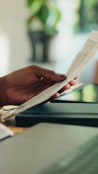 Hands, woman and reading receipt with pen for accounting, finance report and audit balance. Female person, calculate and invoice for financial expenses, review payment and asset management for income
