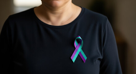 Woman honors Suicide Loss Day with awareness ribbon. Suicide Loss Day memorializes lives lost to suicide with supportive symbolic gesture.