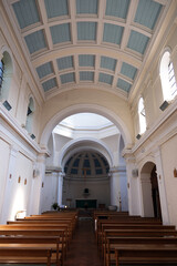 Bright Church Nave and Aisle with Pale Blue Barrel Vault Ceiling Leading to Chancel and Apse with Altar and Crucifix, St Laurence, Petersfield