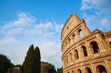 View of the Roman Colosseum in Rome at sunset.