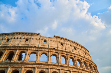 View of the Roman Colosseum in Rome at sunset.