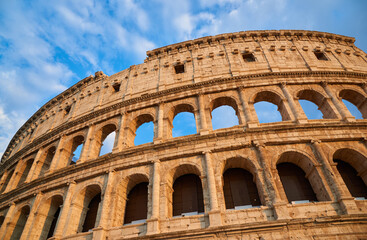 View of the Roman Colosseum in Rome at sunset.