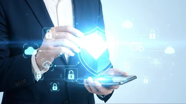 Cybersecurity concept: Businessman holding smartphone with glowing shield icon, symbolizing data protection, network security, and digital privacy ... - Powered by Adobe