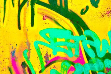 Vibrant neon graffiti art in turquoise, pink, green on textured yellow wall. Retro 80s, acid style, bold colors. Street art, creative backgrounds, urban visuals, modern 2000s aesthetic.
