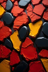 Abstract colorful stone arrangement on dark background with a textured surface