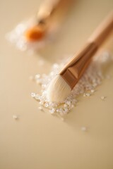 Brush with white particles on beige surface close up is a minimalist composition of beauty tools and textures creating a serene aesthetic
