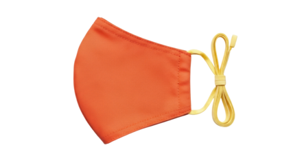 Isolated bright orange face mask with yellow elastic adjustable straps in studio shot
