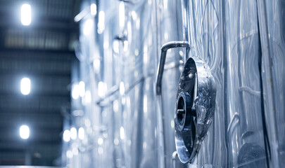 Industrial beer factory with stainless steel fermentation tanks