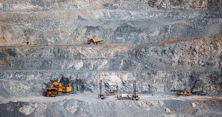 Large-Scale Open Pit Mining Operations with Heavy Machinery on Rocky Terrain