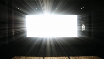 Fototapeta premium Streaming sunlight pouring through bright rectangular opening in parking garage, casting long beams