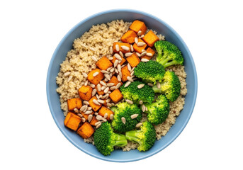 Isolated plant-based bowl with quinoa, sweet potato, broccoli, and sunflower seeds on top