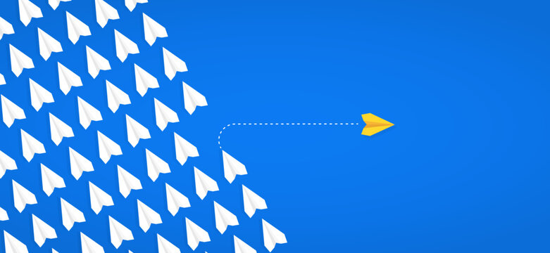 Yellow paper plane taking a different path while white planes follow, symbolizing thinking differently, changing paths, and embracing new directions