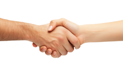 Two hands engage in a firm handshake, representing a successful agreement during a professional meeting.