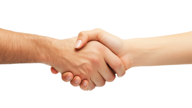 Two hands engage in a firm handshake, representing a successful agreement during a professional meeting.