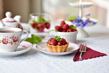 Mini tart with raspberries fruits on the table
