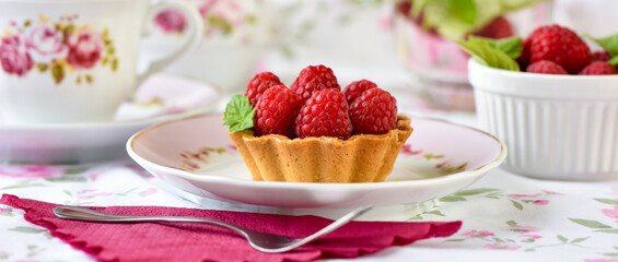 Mini tart with raspberries fruits on the table

