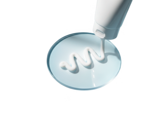 White cream dispensed in a wavy line on a clear circular surface isolated on transparent background