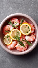 Raw marinated prawns with lemon and herbs top view