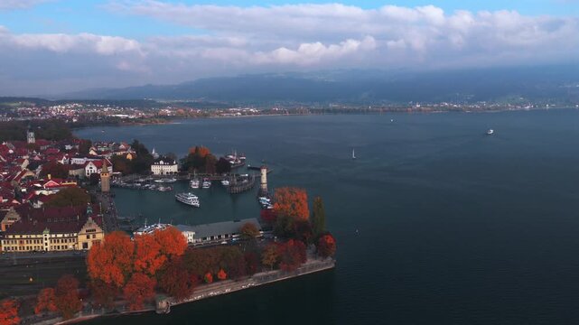 Landau Obersee Bodensee fall autumn leaf golden hour sunset Germany aerial drone view island shoreline marina sail boat ferries European lake Constance Switzerland Austria border bluesky clouds circle