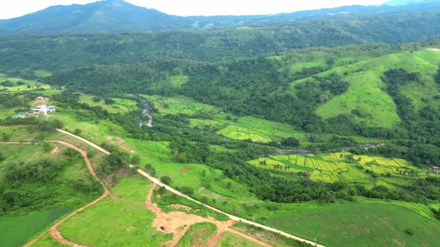 A wide right pan aerial of the view seen in Quinawan Mountain View with the valley seen on the right is the Quinawan beach in Mariveles Bataan, Philippines