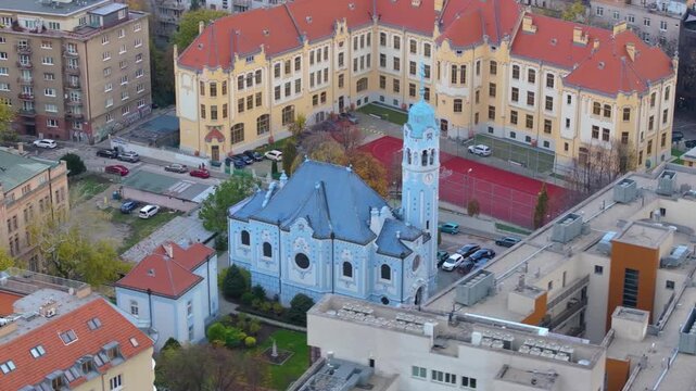 4K cinematic drone footage of the Blue Church in Bratislava, highlighting the building&rsquo;s distinctive blue colors, decorative mosaics, and curved architectural shapes in the heart of Bratislava._11