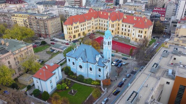 4K cinematic drone footage of the Blue Church in Bratislava, highlighting the building&rsquo;s distinctive blue colors, decorative mosaics, and curved architectural shapes in the heart of Bratislava._15