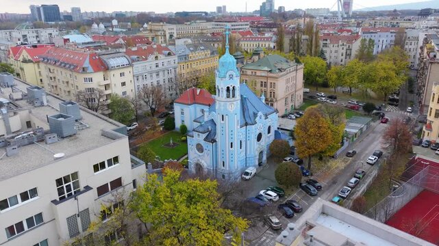 4K cinematic drone footage of the Blue Church in Bratislava, highlighting the building&rsquo;s distinctive blue colors, decorative mosaics, and curved architectural shapes in the heart of Bratislava._07