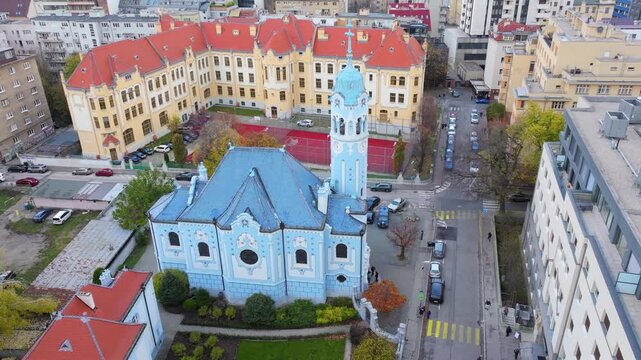 4K cinematic drone footage of the Blue Church in Bratislava, highlighting the building&rsquo;s distinctive blue colors, decorative mosaics, and curved architectural shapes in the heart of Bratislava._10