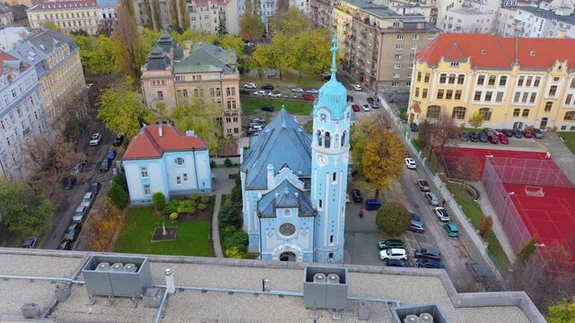 4K cinematic drone footage of the Blue Church in Bratislava, highlighting the building&rsquo;s distinctive blue colors, decorative mosaics, and curved architectural shapes in the heart of Bratislava._17