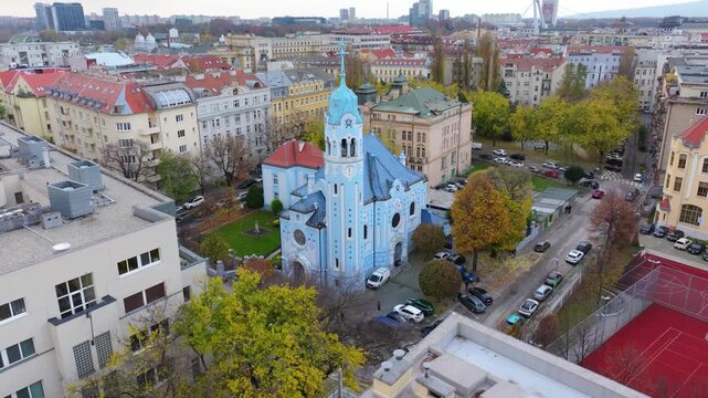 4K cinematic drone footage of the Blue Church in Bratislava, highlighting the building&rsquo;s distinctive blue colors, decorative mosaics, and curved architectural shapes in the heart of Bratislava._08