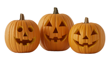 Three bright orange carved pumpkins with happy faces on them, isolated on a transparent PNG