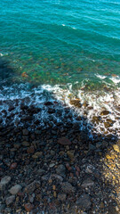Tenerife Island in the Atlantic Ocean, Canary Islands. Waves lap the coastline, aerial view.