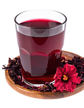 Deep red ghanaian sobolo hibiscus tea in a tumbler, a healthy and caffeine-free west african refreshment, isolated on white background
