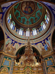 Obraz premium Interior of the Nativity of Christ Cathedral in Chisinau, Moldova: gilded chandelier, decorated iconostasis and dome with Christ .