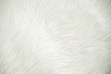 Soft white faux fur texture background with fluffy strands detail
