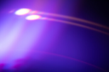 abstract light patterns with vibrant purple and blue hues creating a dynamic visual effect, neutral background, clear negative space, clean composition, balanced framing, minimalist layout, editorial