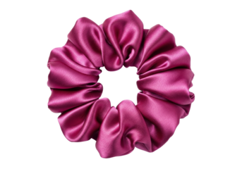 Isolated scrunchie hair tie in magenta color with soft shiny texture, trendy hair fashion