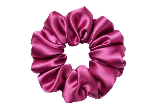 Isolated scrunchie hair tie in magenta color with soft shiny texture, trendy hair fashion