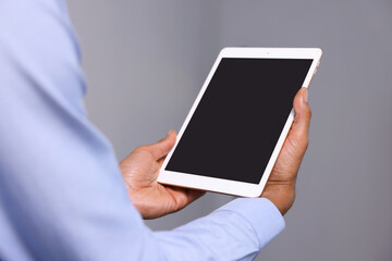 African-american man using tablet in office, closeup