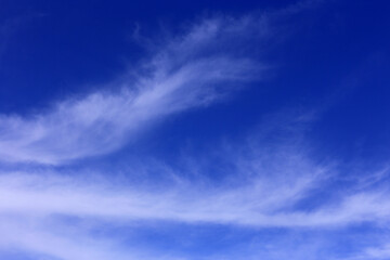 Obraz premium Backgrounds. Cloudscape. Deep blue sky with beautiful cirrus and cirrostratus clouds. Portugal.