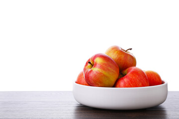 Ripe red apples in bowl on wooden table against white background, closeup. Space for text